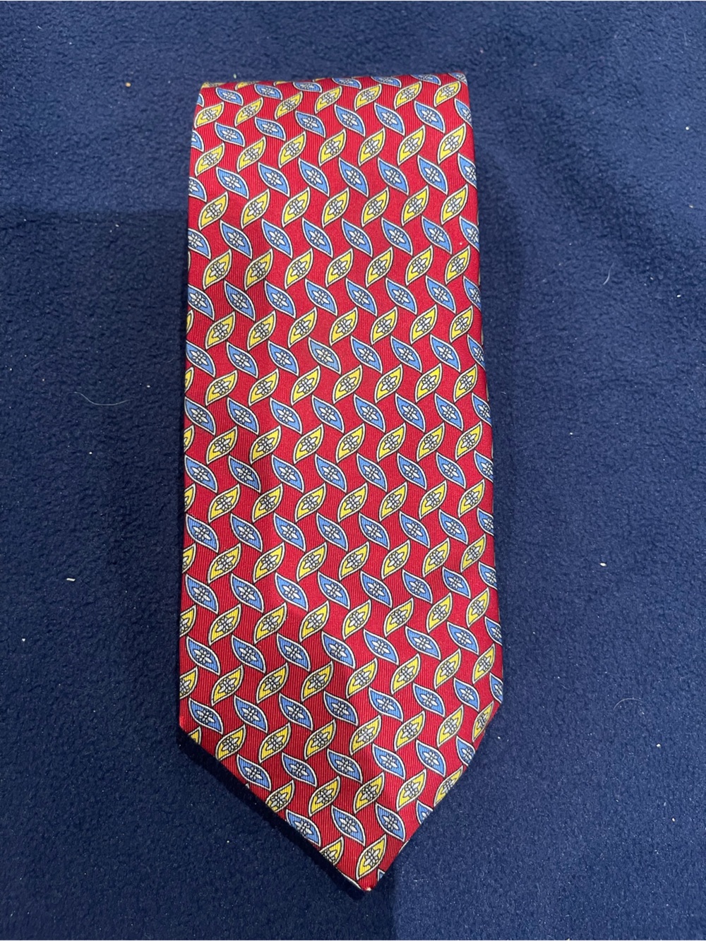 Men's Red Geometric Pattern Tie with Blue and Yellow Accents